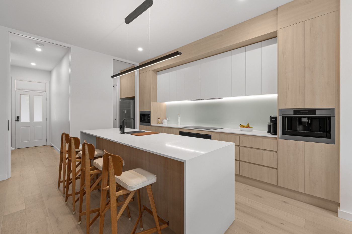 Timber kitchen with a stone waterfall island