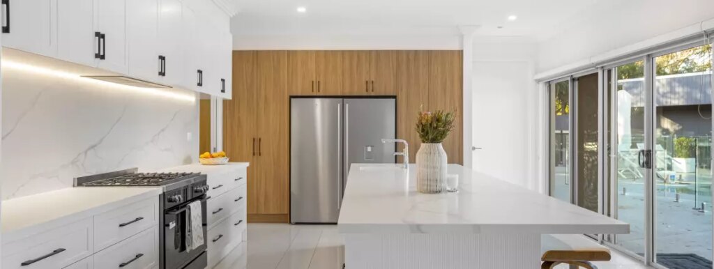 The Kitchens U Build Bayswater showroom &mdash; eight working vignettes and the cabinet-making floor on site